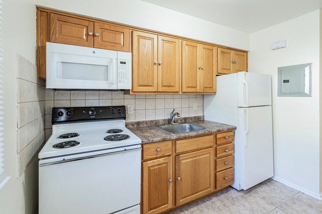 a kitchen with a stove microwave and refrigerator
