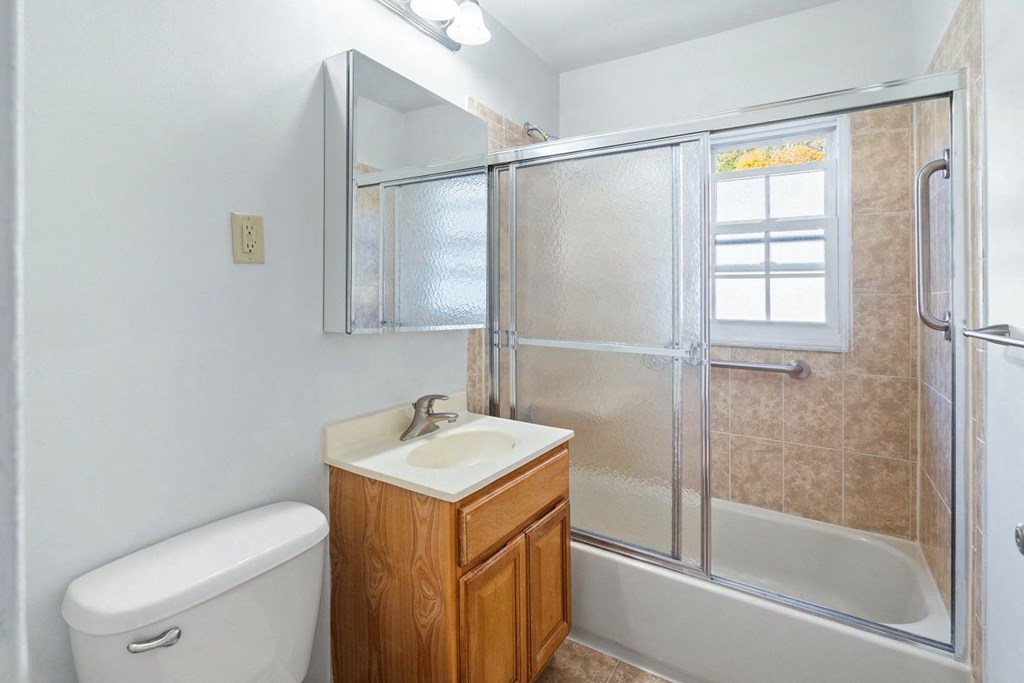 a bathroom with a sink toilet and a shower