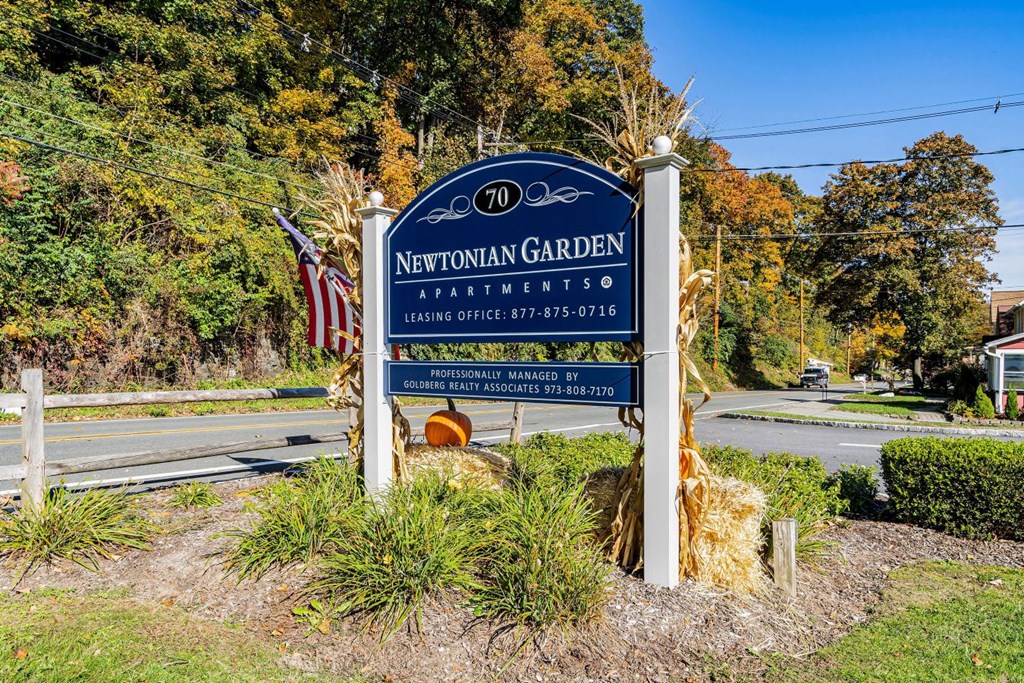 the sign at the entrance to the neighborhood garden