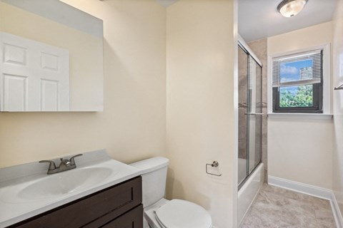 the preserve at ballantyne commons apartment bathroom with sink toilet and shower
