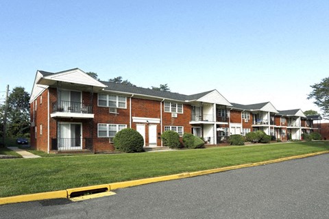 an apartment building on the side of a street