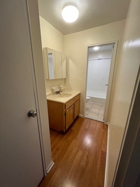 a small bathroom with a sink and a mirror
