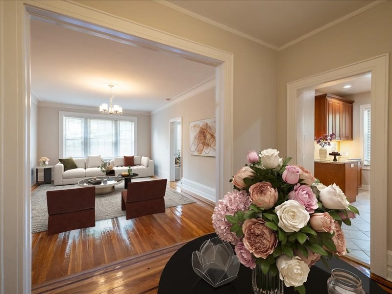 a living room with a vase of flowers on a table