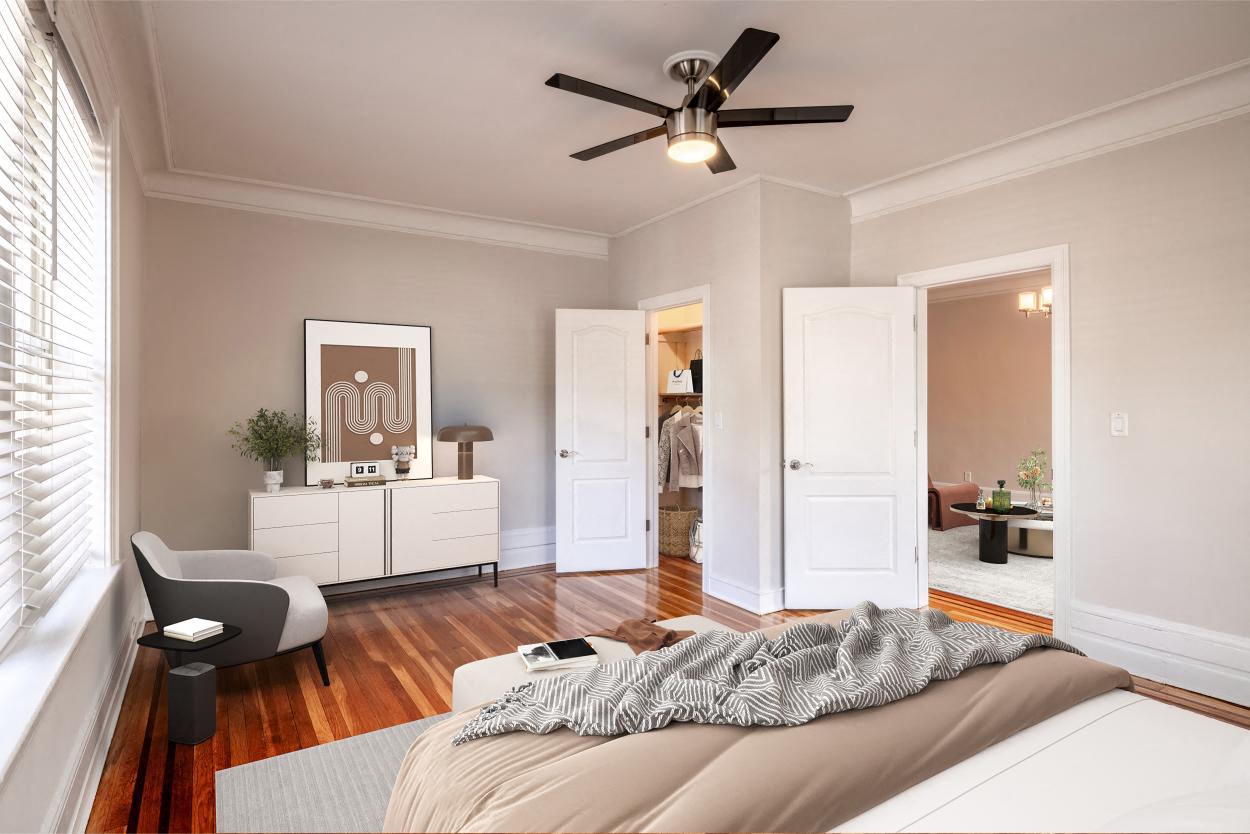 a bedroom with a bed and a ceiling fan
