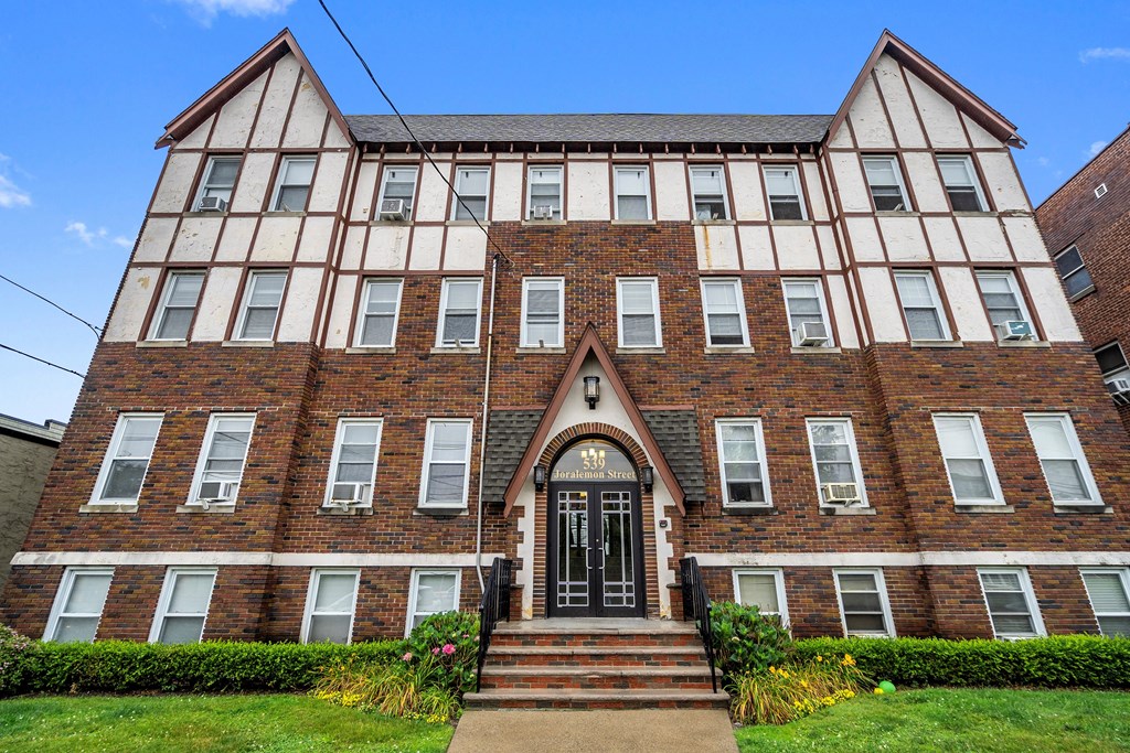 a large brick building with steps in front of it