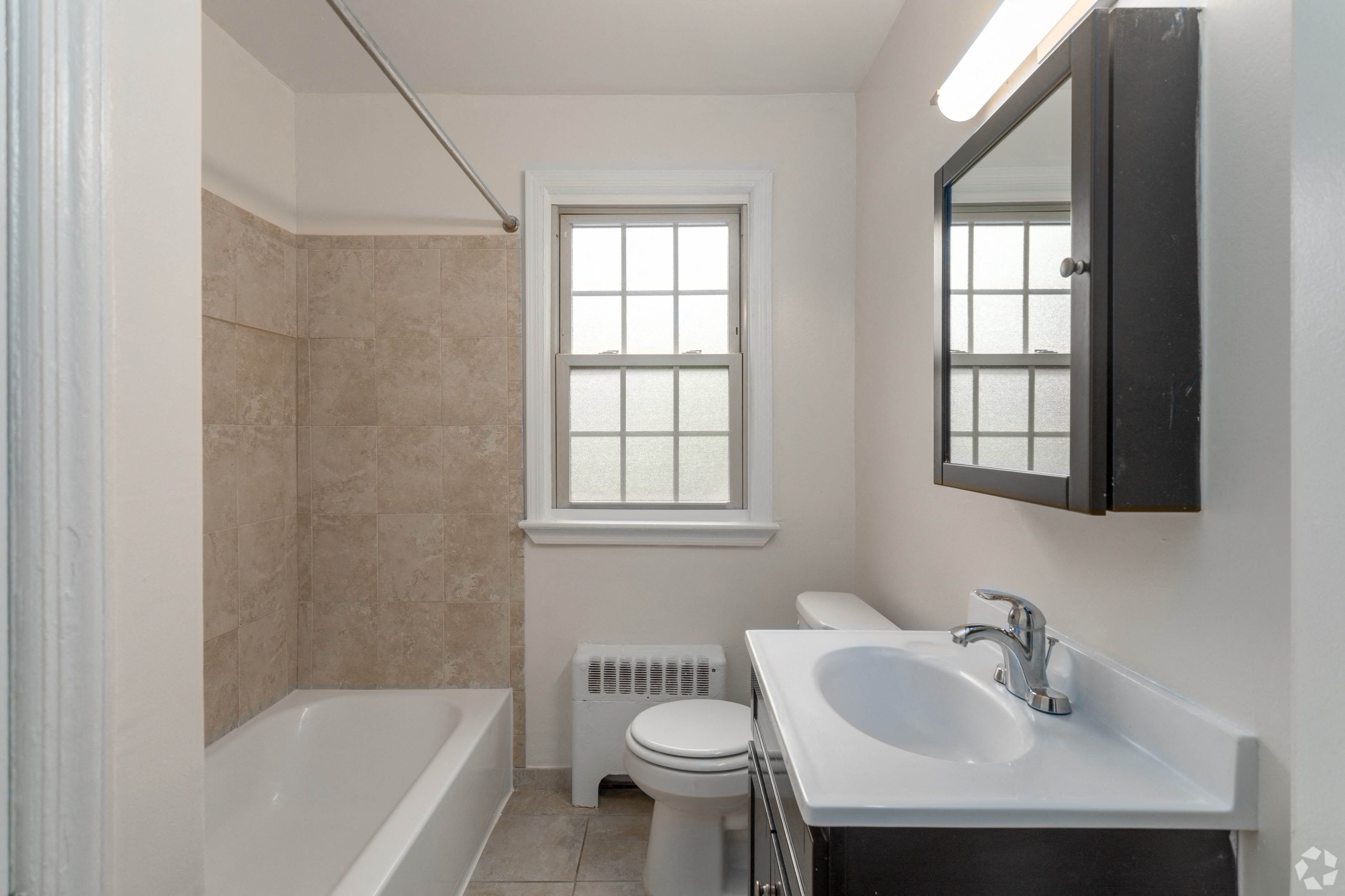 a bathroom with a sink toilet and a bath tub