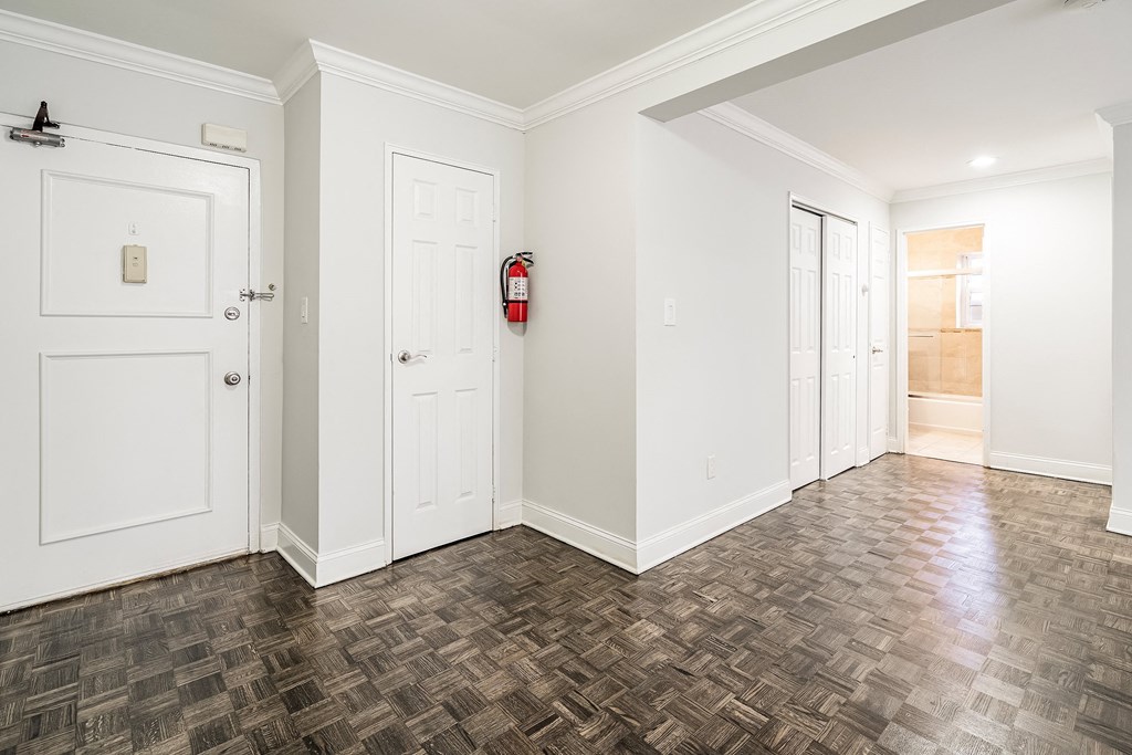 a living room with white walls and white doors