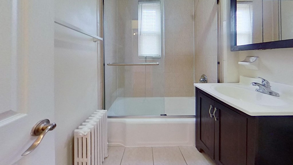 a bathroom with a sink and a shower