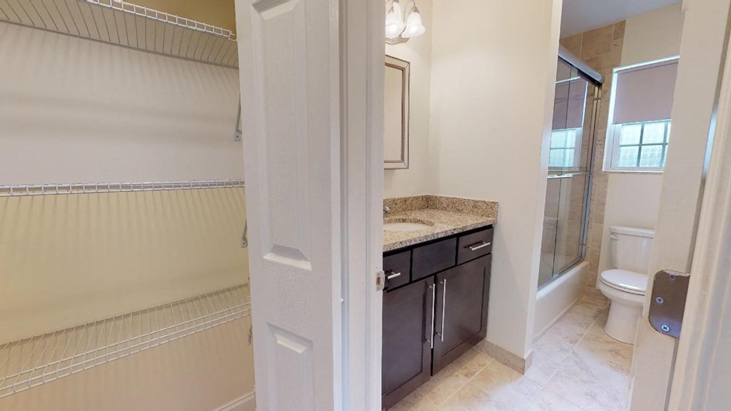 a bathroom with a sink toilet and a shower