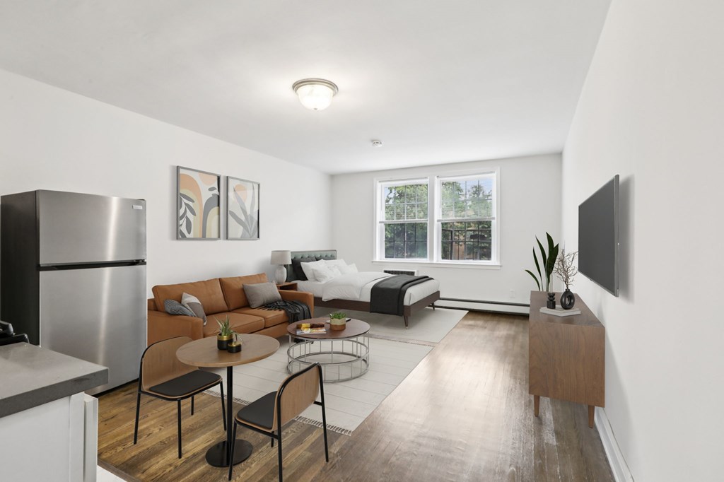 A modern kitchen with a dining table and chairs.