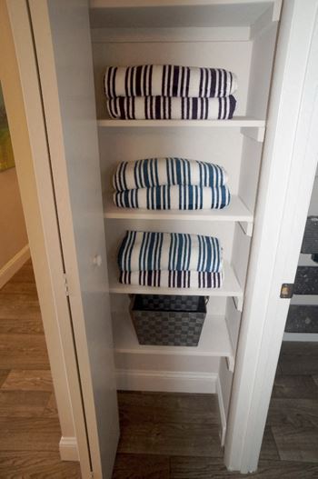 Linen Closets with Built-In Shelving