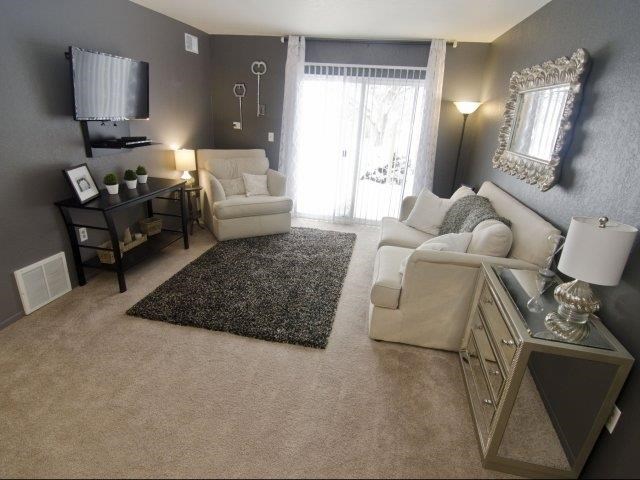 a living room with a couch and a table