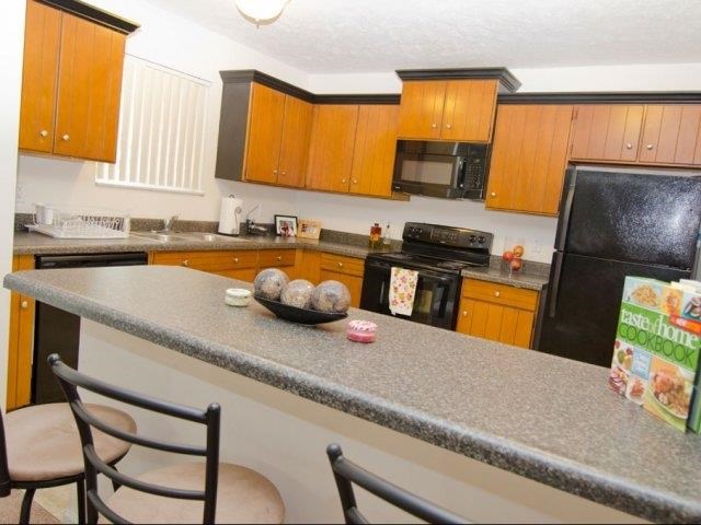 a kitchen with a granite counter top