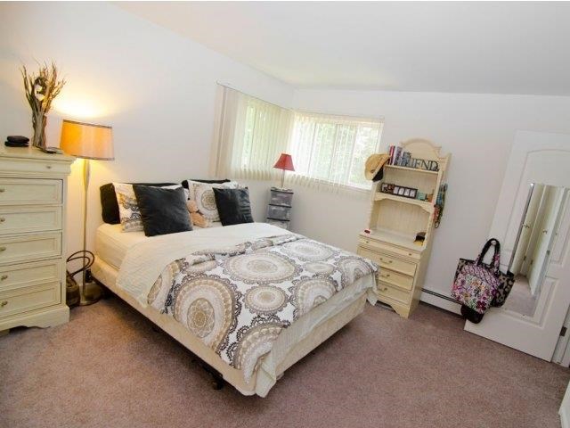 a bedroom with a bed and a closet