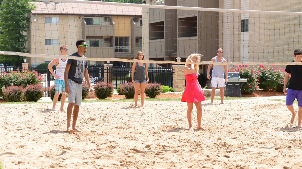 Sand volleyball in East Lansing Apartments near Michigan State University | Capitol Villa Apartments near MSU