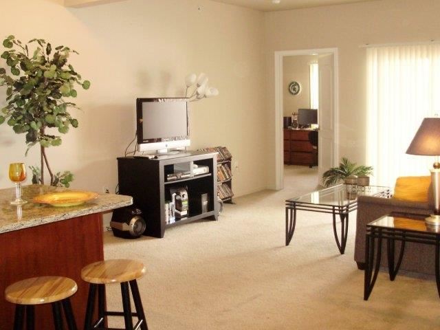a living room with a television and a table