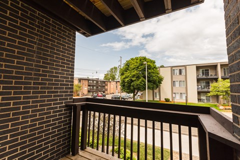 the view from the balcony of an apartment building on a sunny day