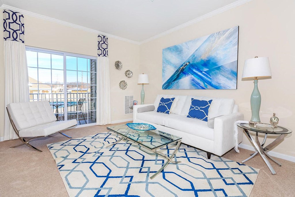 a living room with a white couch and a table