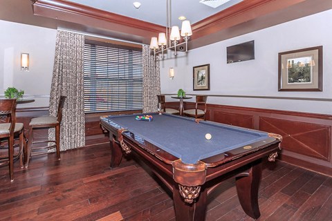 a game room with a pool table