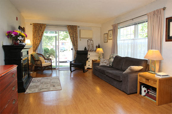 a living room with a couch and a fireplace