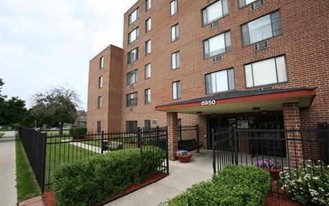 A brick building with the number 6950 on the top.