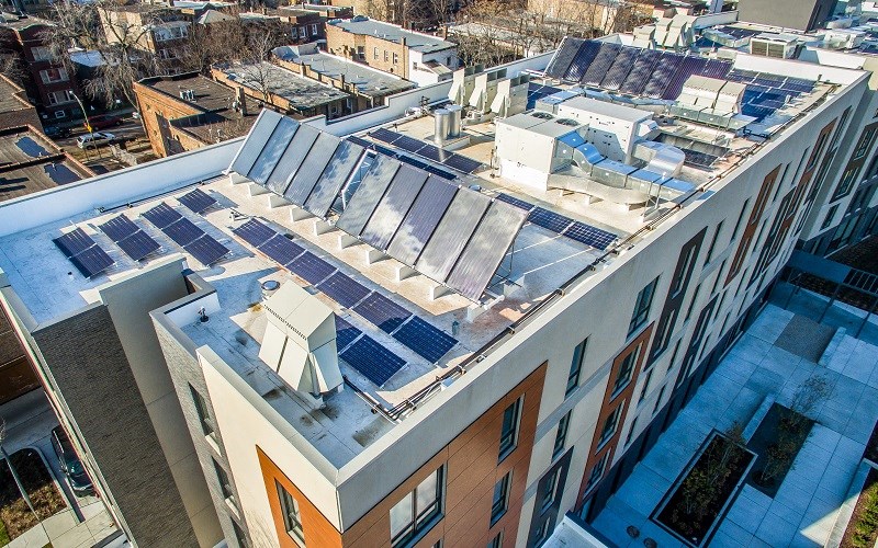 A building with solar panels on the roof.