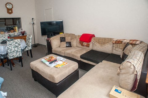 a living room with two couches and a tv