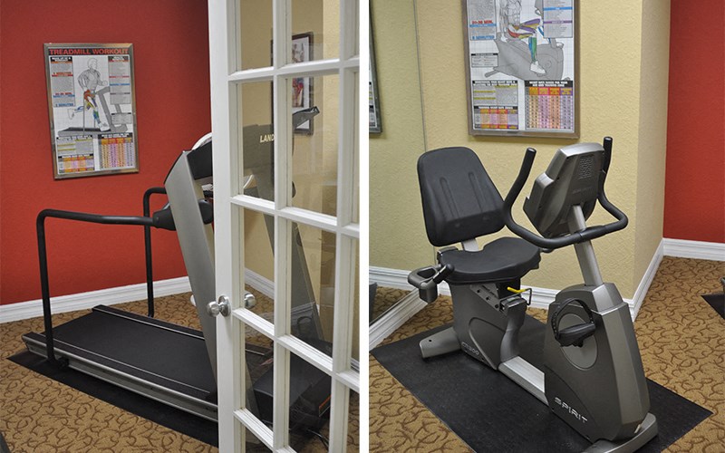 a treadmill and an exercise bike in a gym