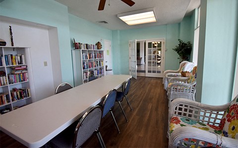 a dining room with a long table and chairs