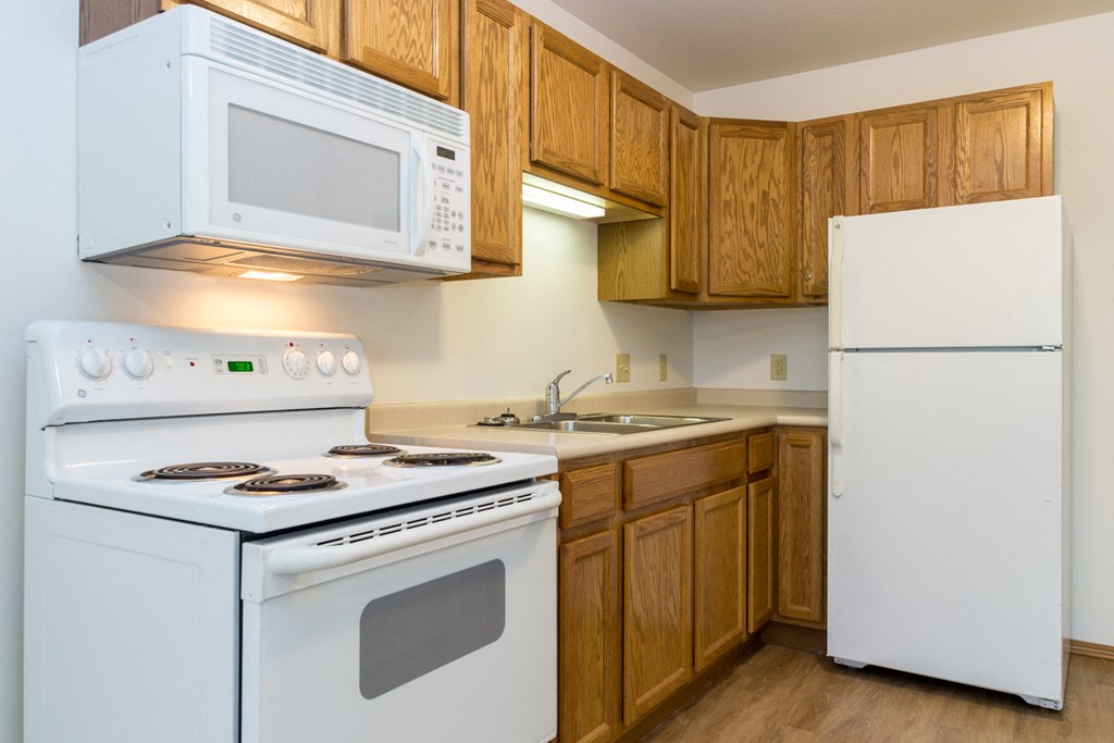 a kitchen with a stove microwave and refrigerator