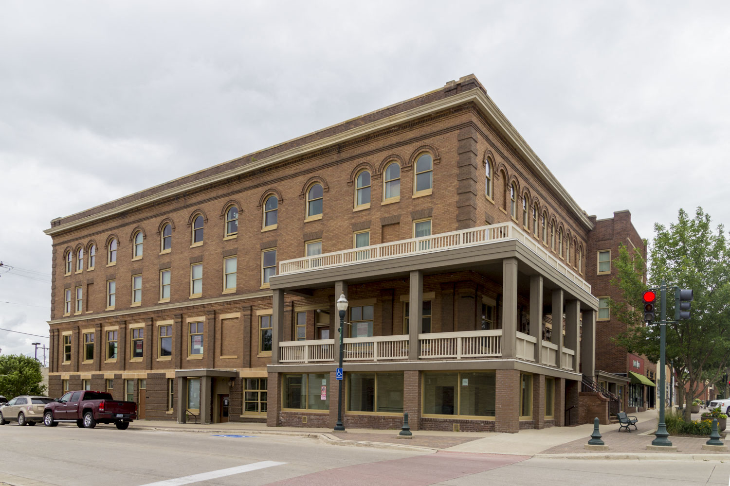 a large brick building on the corner of a street