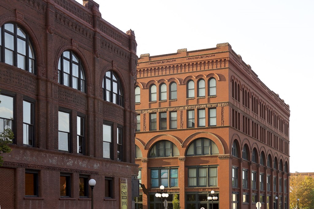 the facade of a large brick building with many windows