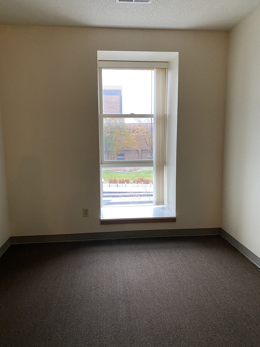 an empty room with a window in it