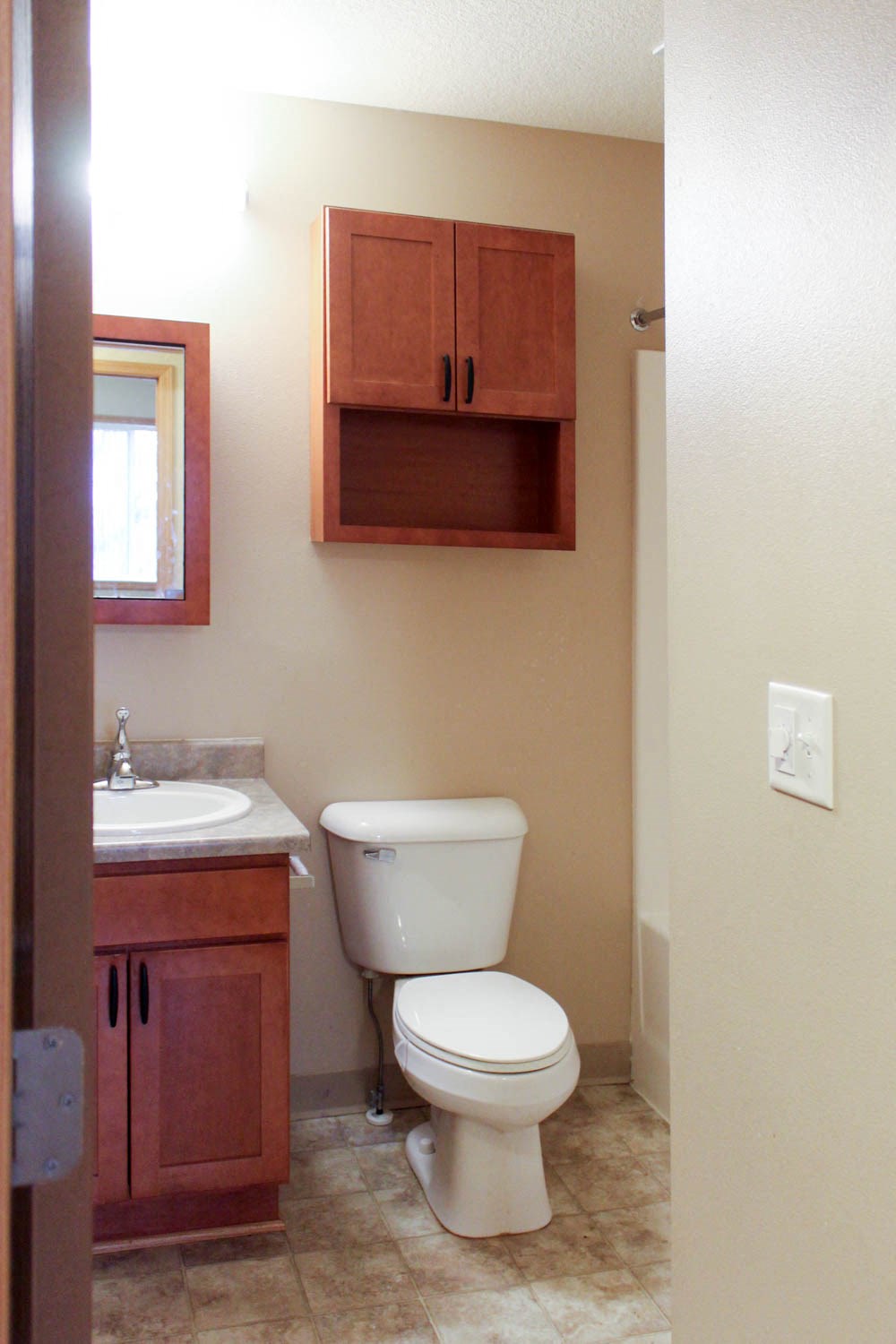 a bathroom with a toilet and a sink