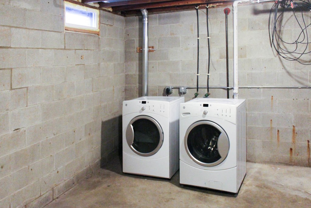 a laundry room with two washing machines in it