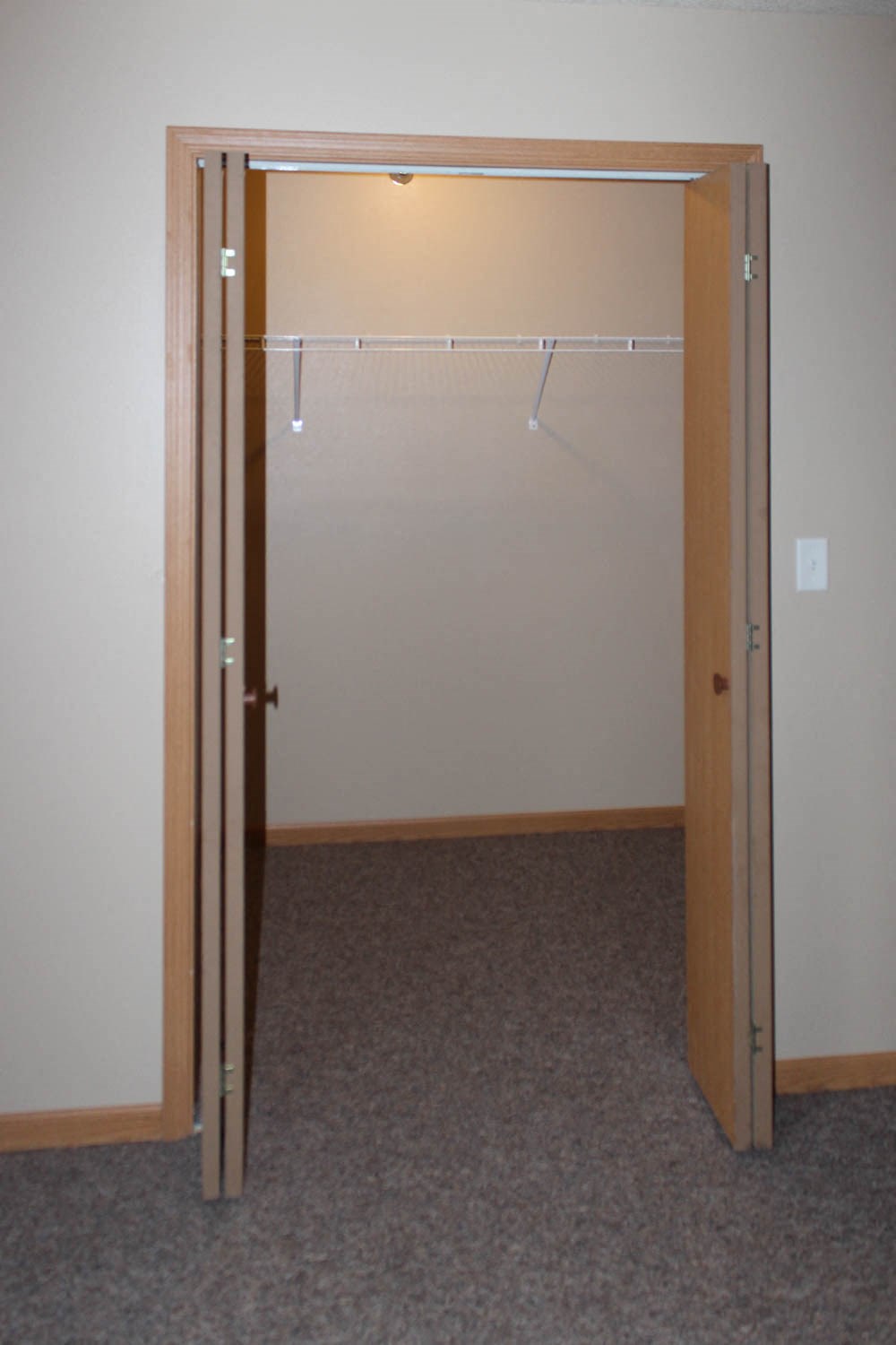 an open door to a closet in a room