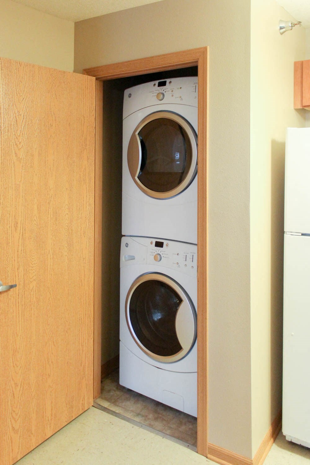 a small laundry room with a washer and a dryer