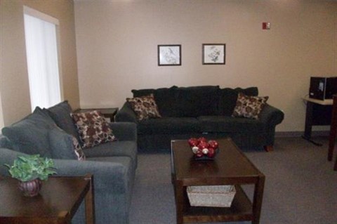 a living room with couches and a coffee table