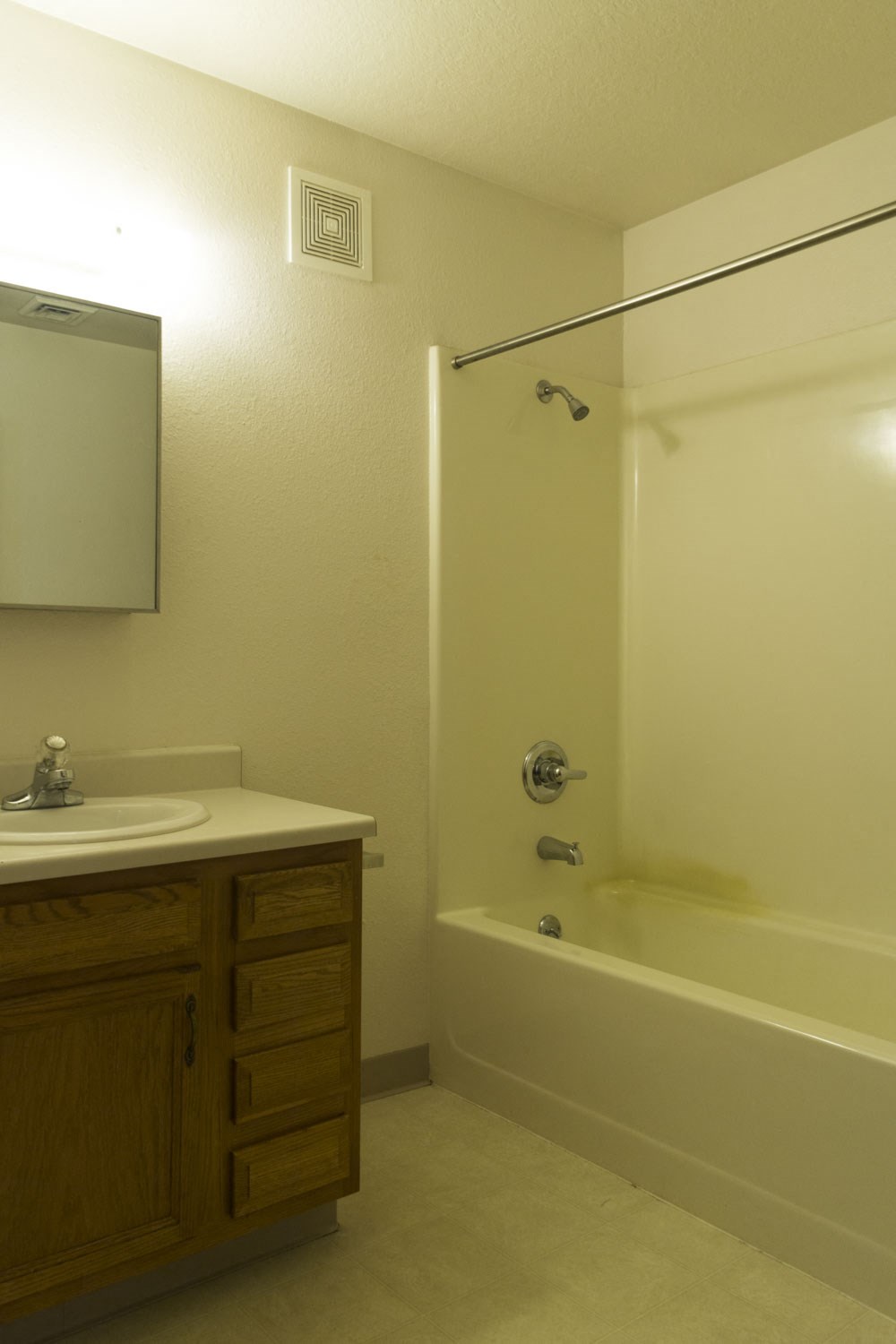 a bathroom with a sink and a bath tub