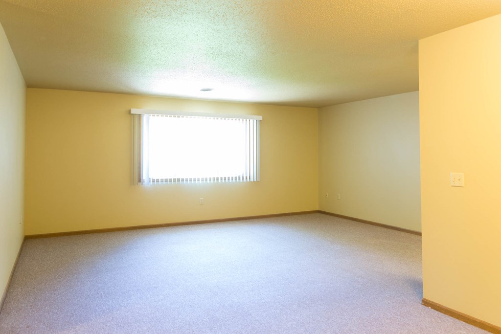 a large empty room with a window