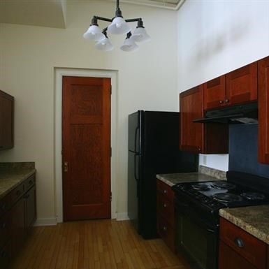 a kitchen with a stove and a refrigerator