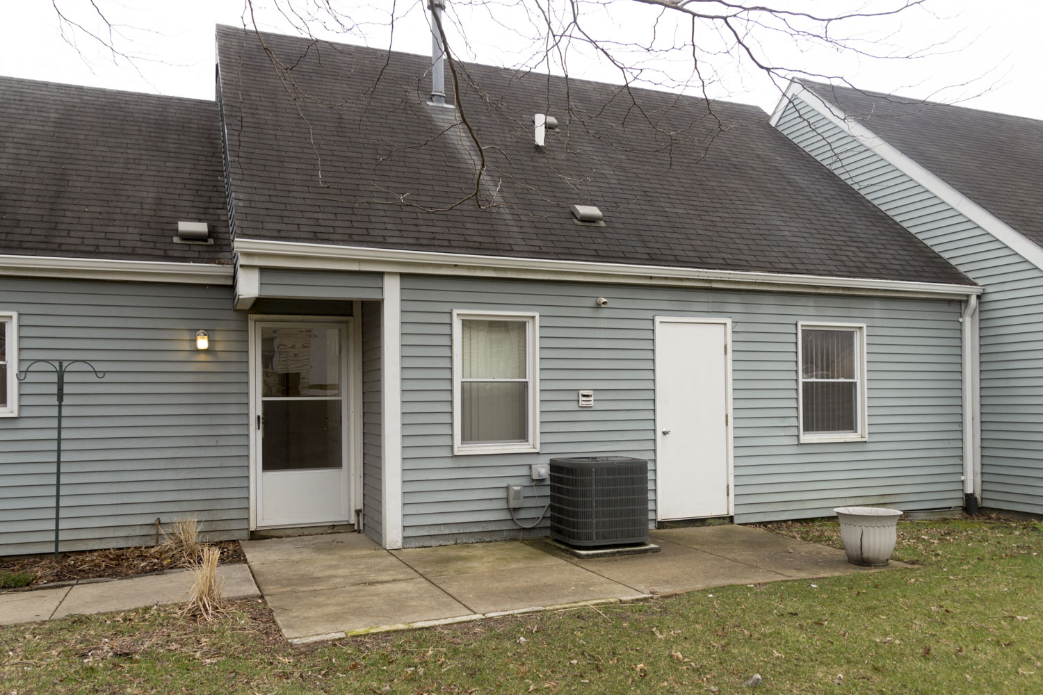 This Meredith Homes three bedroom apartment has a great back patio with a screen door that leads into the kitchen.