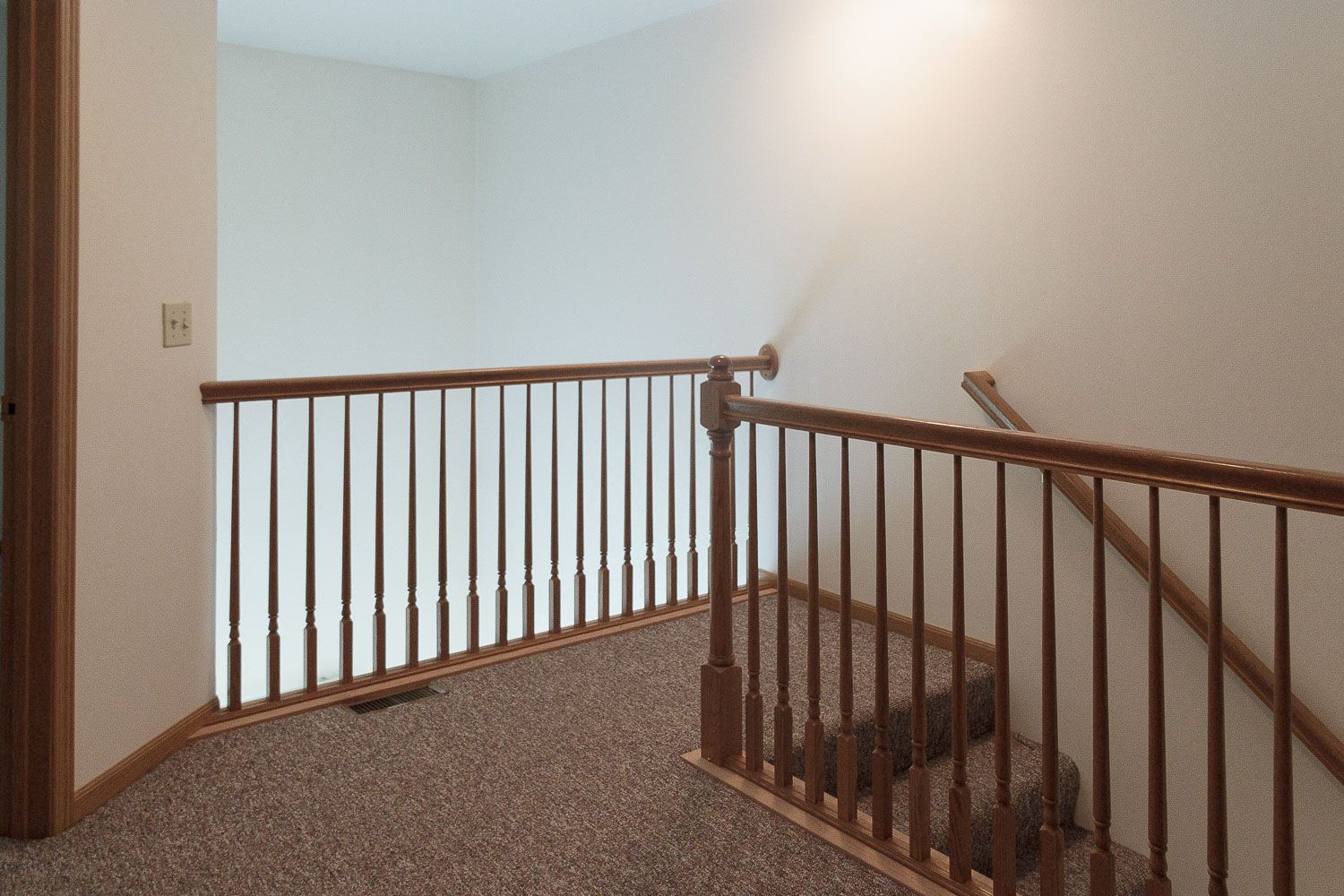 Our two-story floor plans feature a balcony that overlooks the living room.
