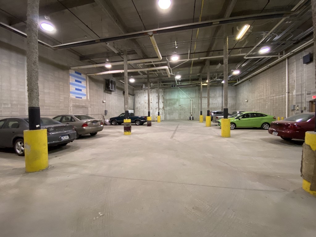 a parking garage with cars parked in it