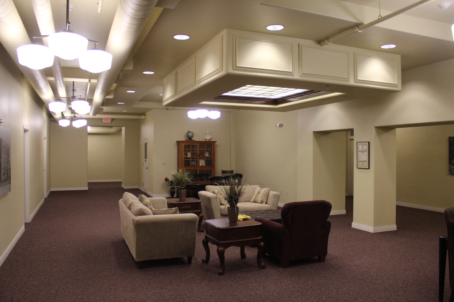 a large room with couches chairs and a table
