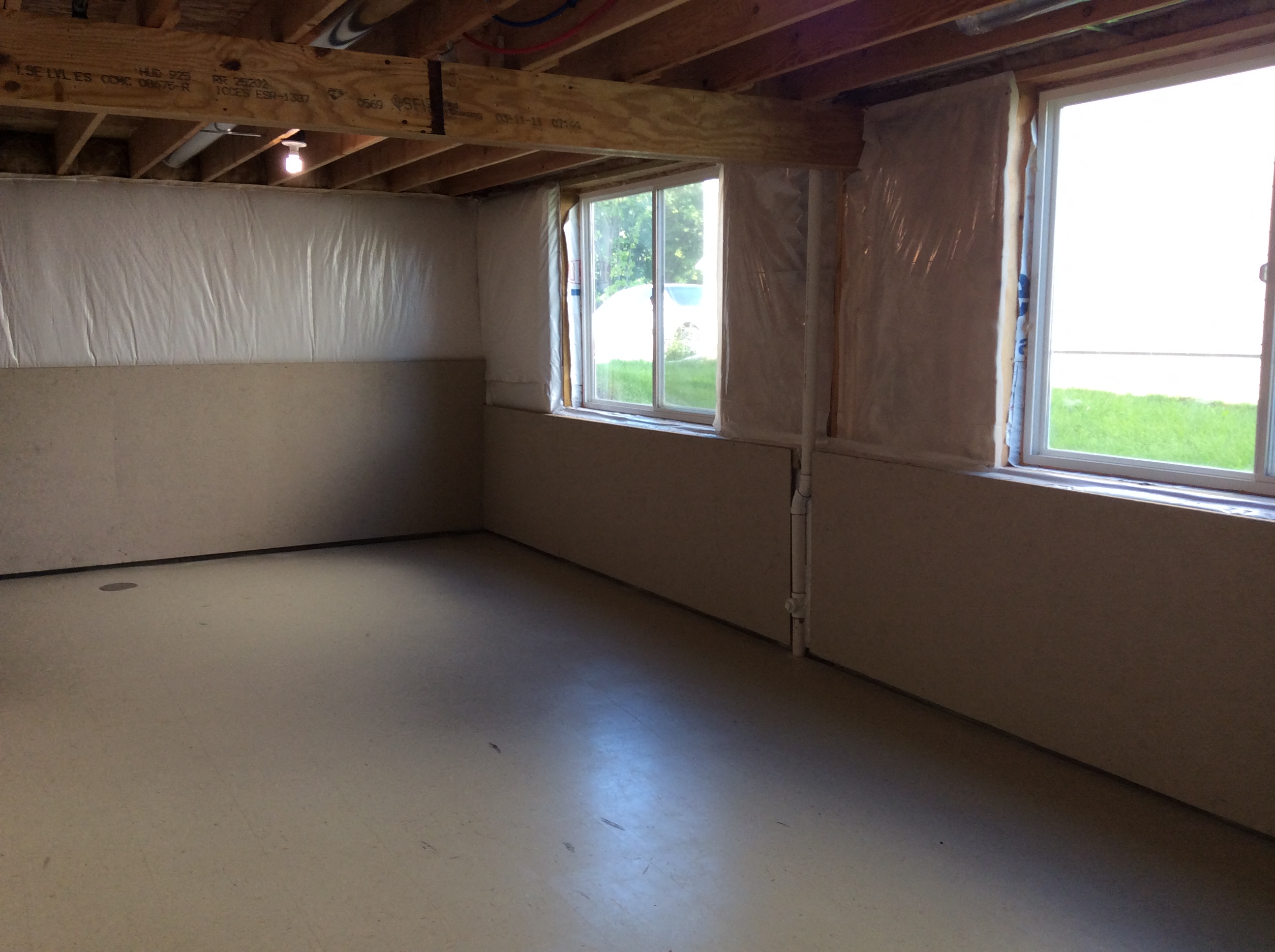 a room with insulation and two windows in it