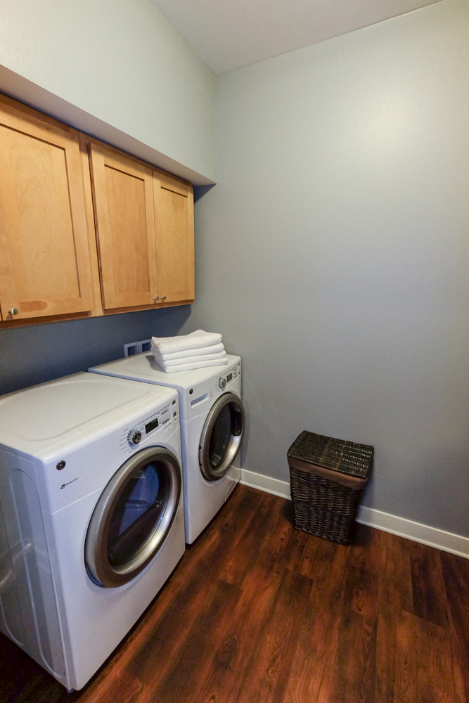 a laundry room with a washer and a dryer