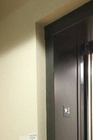 a door is open to a room with a window