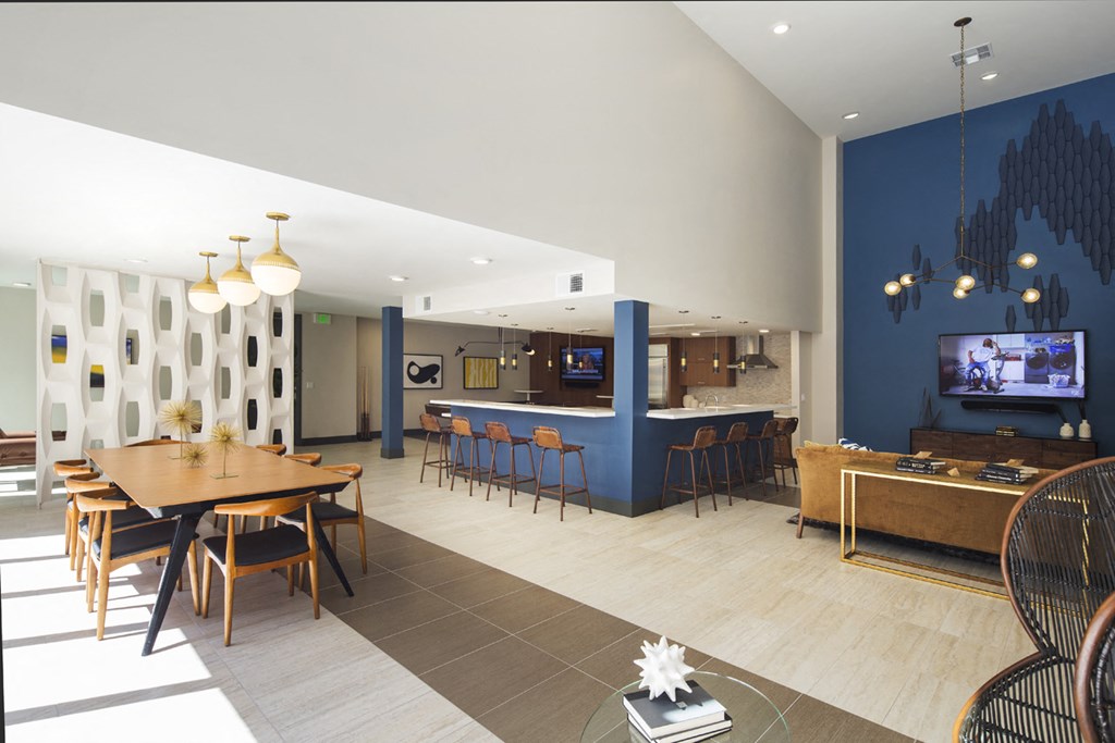 a rendering of a dining room and living room with a table and chairs