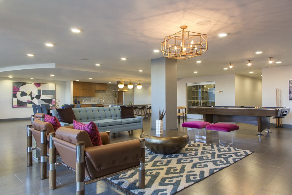 a large living room with furniture and a pool table